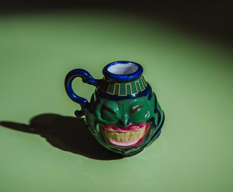 Surreal Entertainment Pot Of Greed mini mug in use with espresso, perfect for quick caffeine boosts.