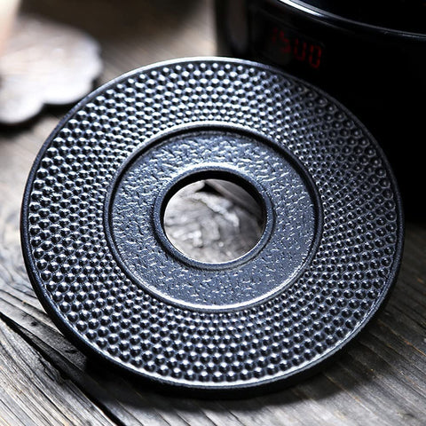 Suyika tea boiling setup mat helps maintain gentle simmer.