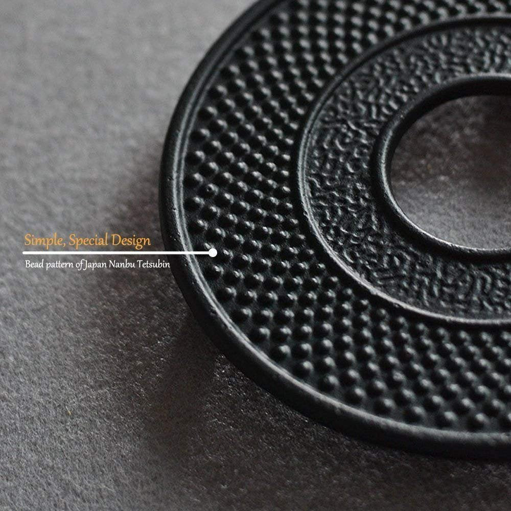 Suyika teapot trivet in black cast iron keeps kettle stable on stove.