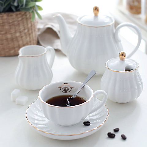 Sweejar teapot, sugar bowl, cream pitcher and teaspoons for complete service.