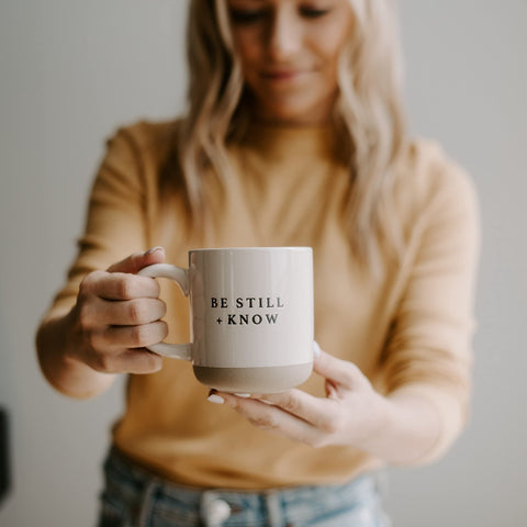 Sweet Water Decor Be Still and Know mug on kitchen counter, cozy centerpiece for tea.