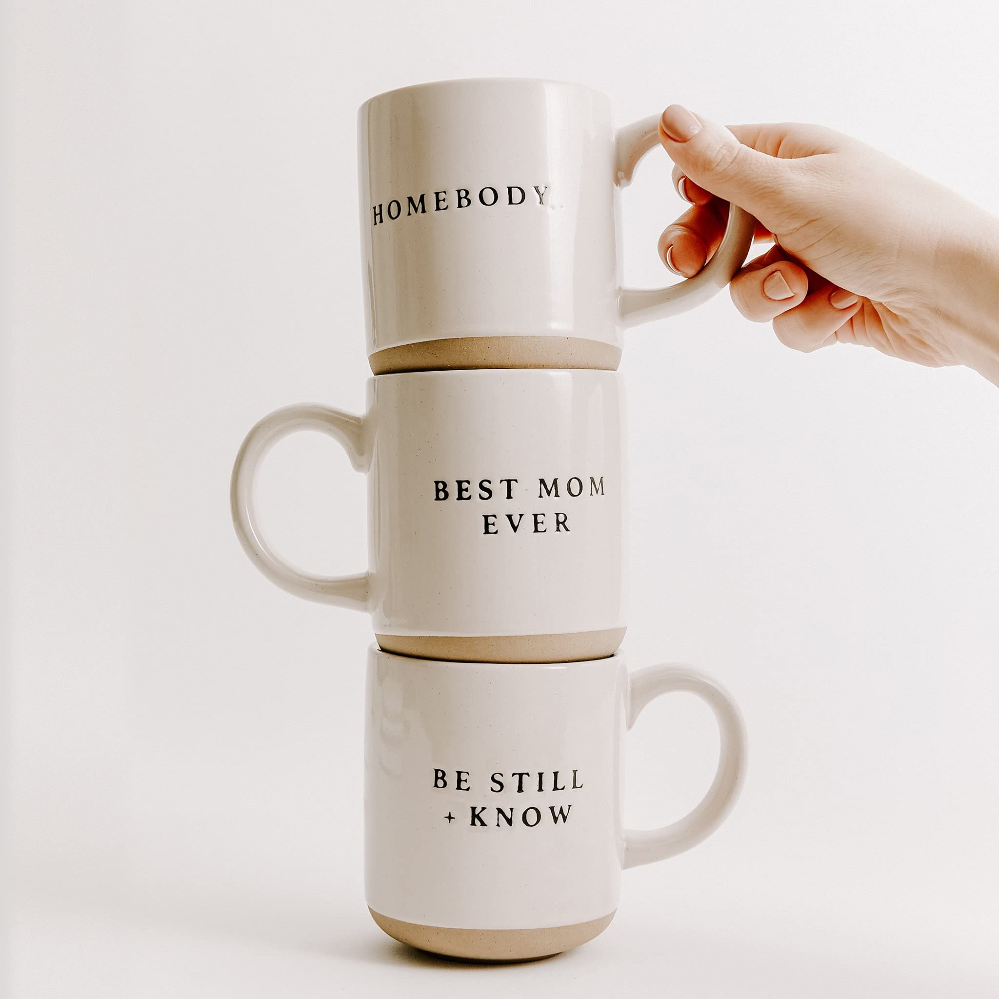 Sweet Water Decor Be Still and Know mug at desk, stylish reminder during work breaks.