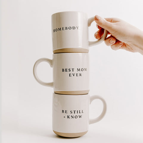 Sweet Water Decor Be Still and Know mug at desk, stylish reminder during work breaks.