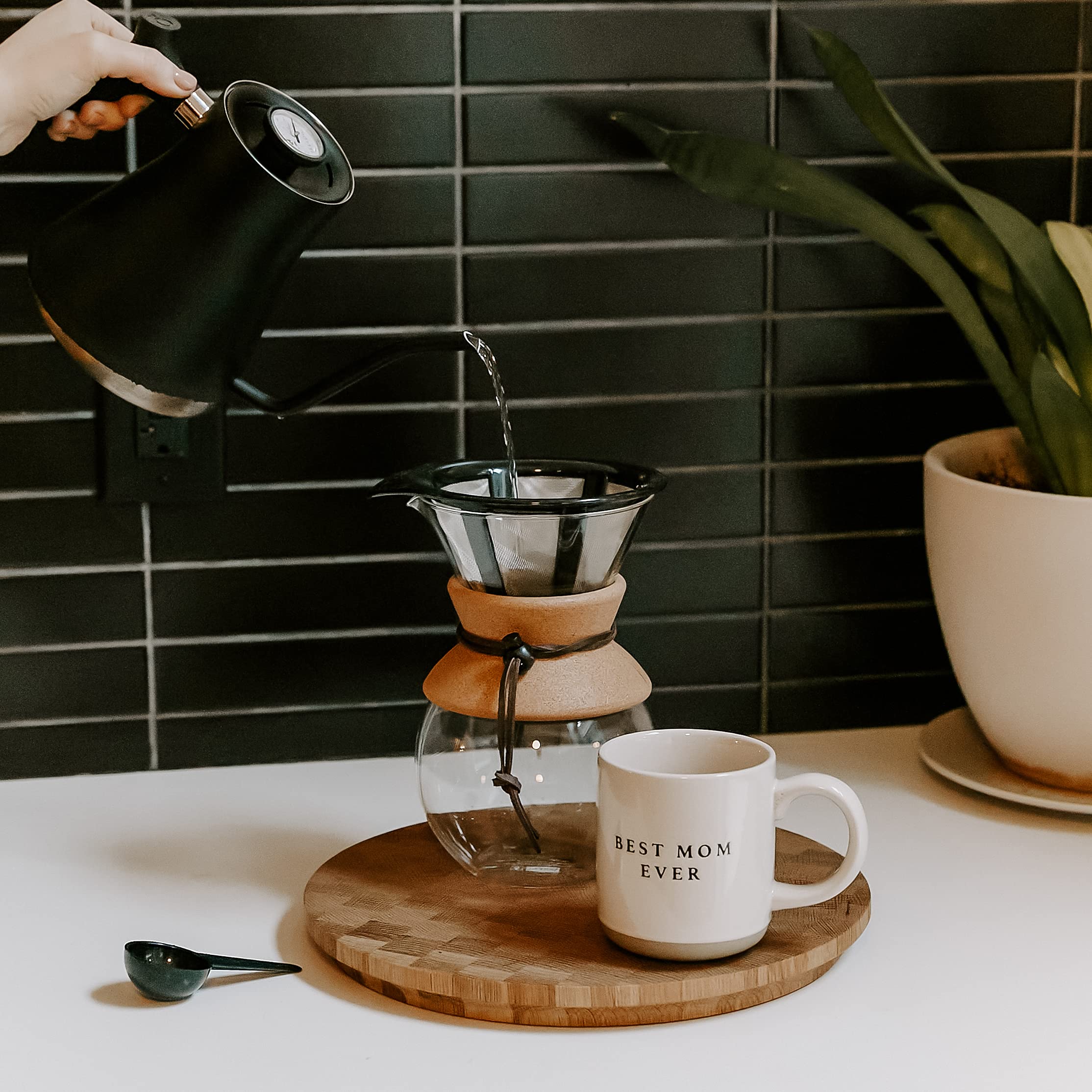 Sweet Water Decor Be Still and Know mug steaming, enhances warm beverages during cold days.