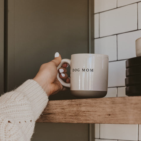 Sweet Water Decor Dog Mom mug on desk, cozy workspace accessory.