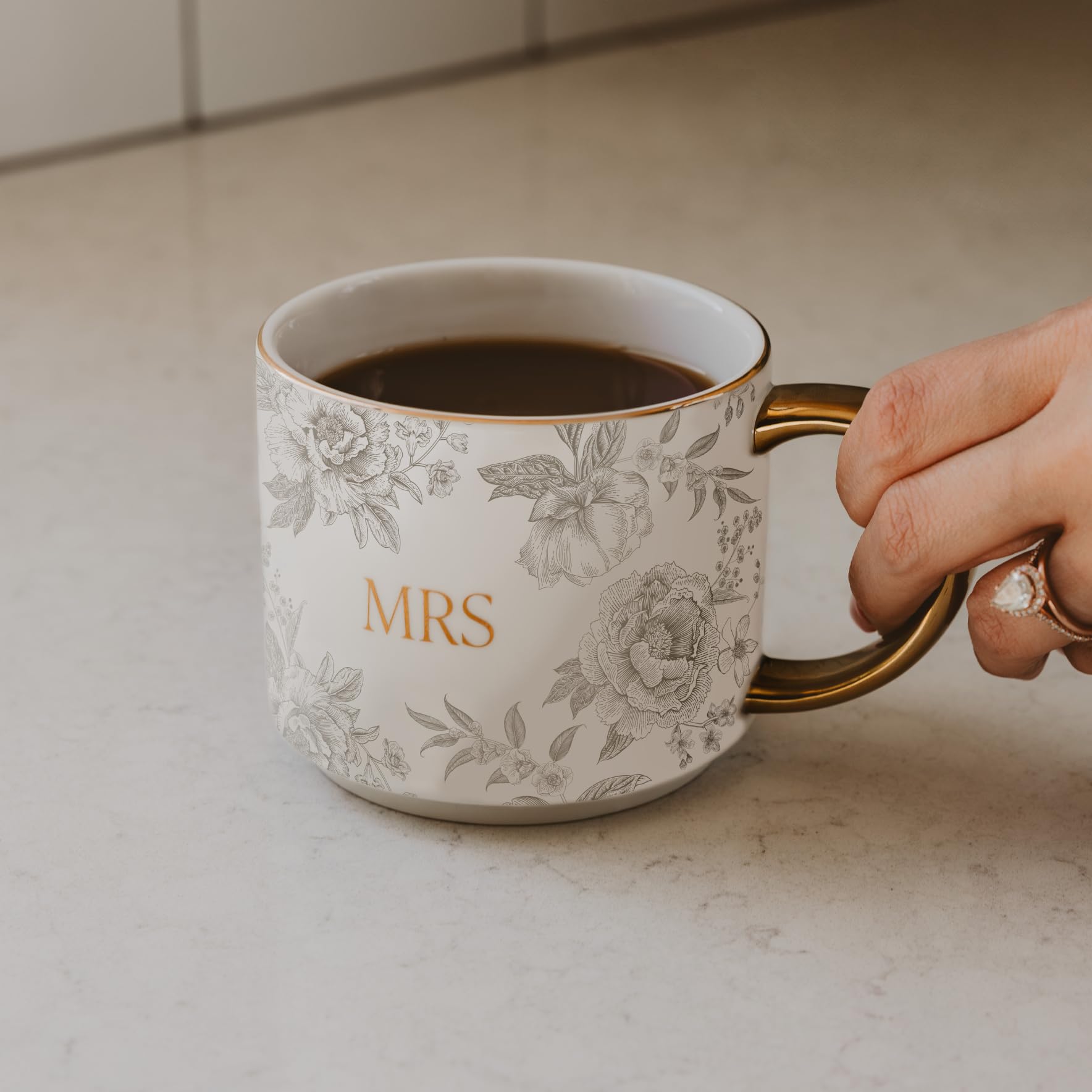 Close-up of the gold handle adds a luxe touch to daily coffee.