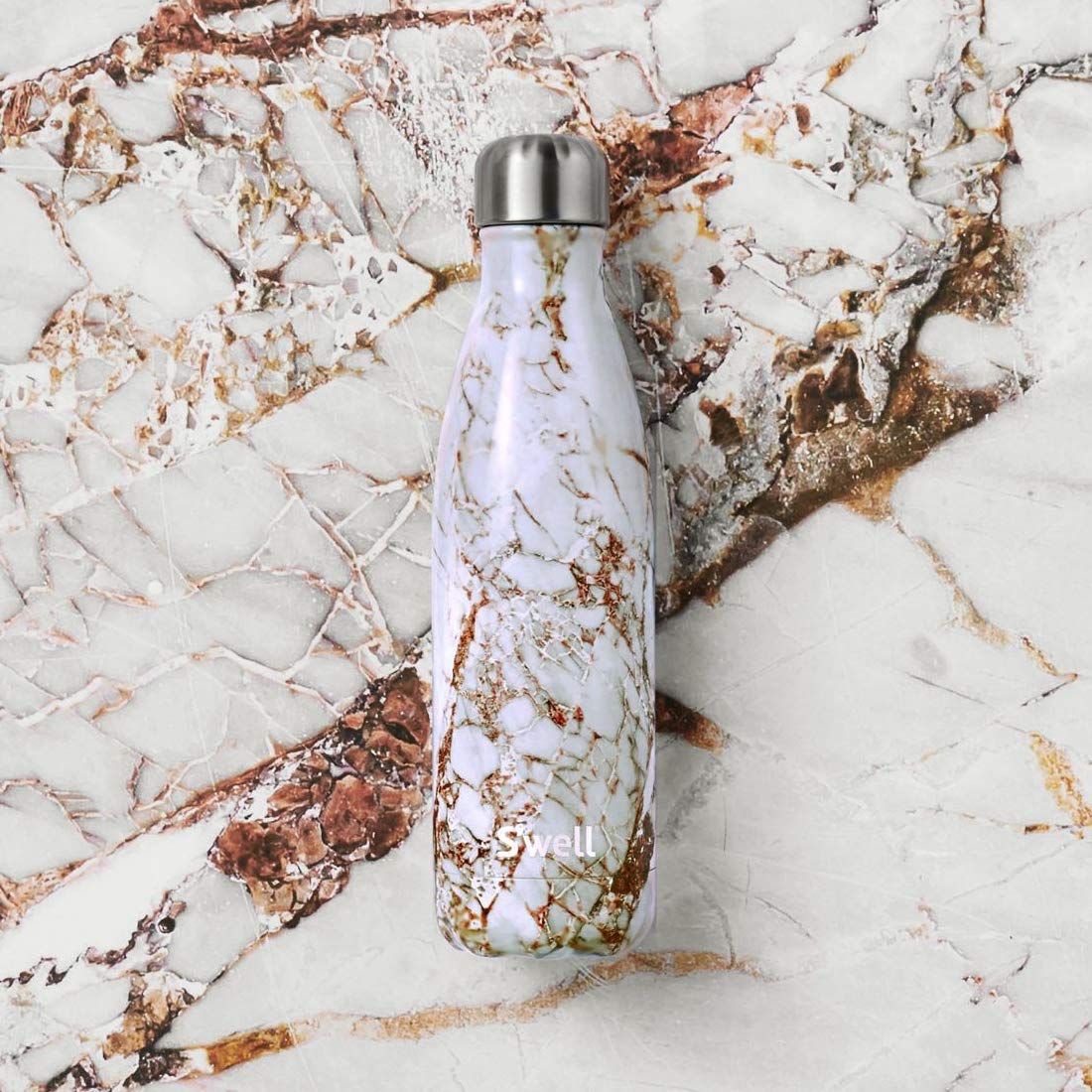 S'well Calacatta Gold 25oz bottle on the go demonstrates portable hydration