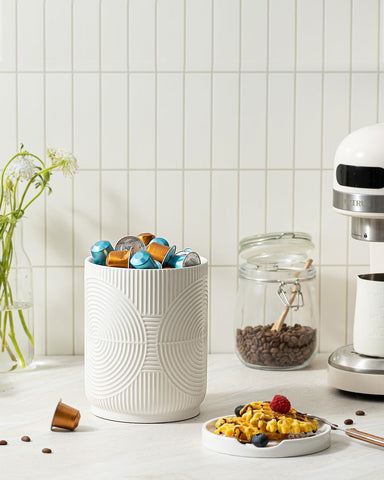 Swicken versatile ceramic container can double as vase or coffee canister.