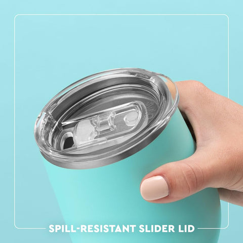 Swig Life travel tumbler with coaster base reduces slips and drips.