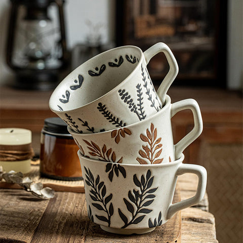 Two-mug botanical set shown on a farmhouse table.