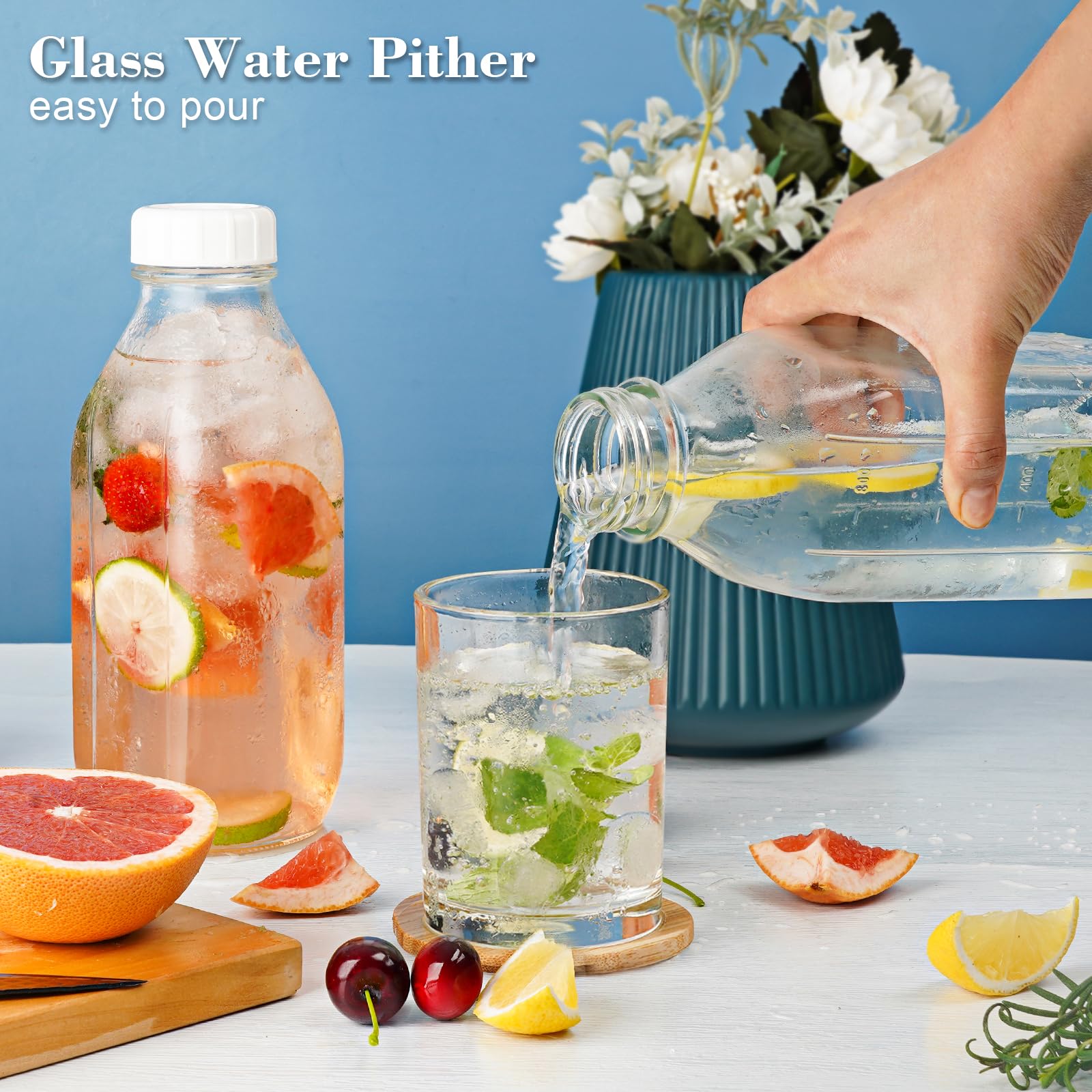 Syntic wide-mouth glass bottle plus lemon slices and ice cubes.