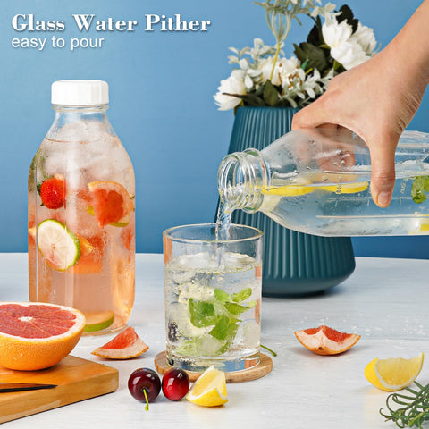 Syntic wide-mouth glass bottle plus lemon slices and ice cubes.