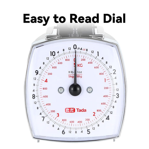 TADA analog scale with removable measuring cup used for liquids.