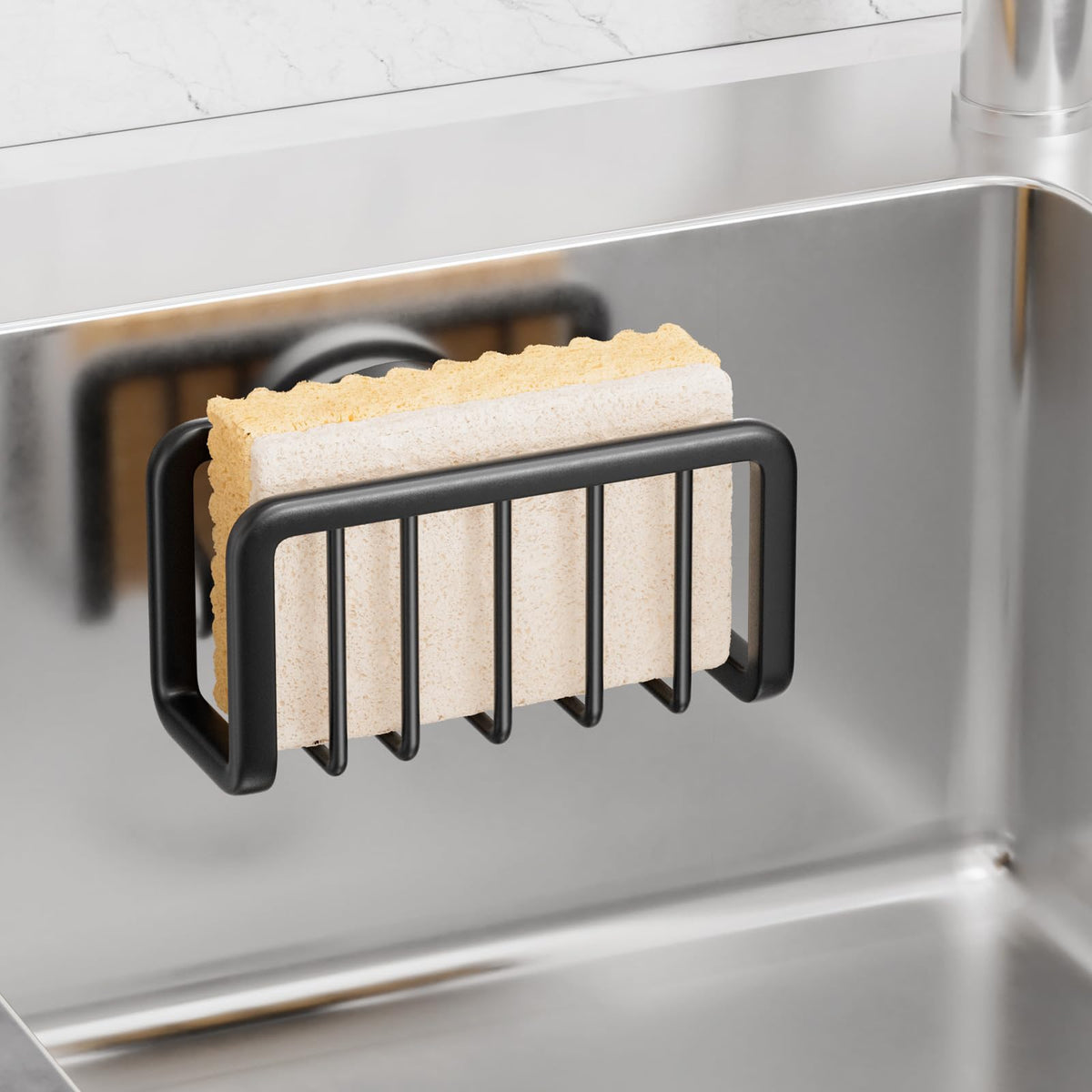 Taili sponge holder on kitchen sink showing strong suction securing sponges