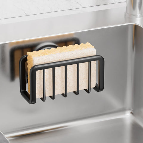 Taili sponge holder on kitchen sink showing strong suction securing sponges