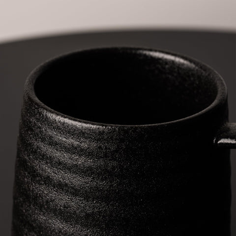TaoTaojarvie mug on table setting enhances home or office decor.