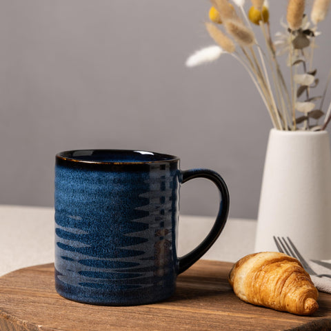 Ergonomic large handle offers comfy grip during tea or espresso.