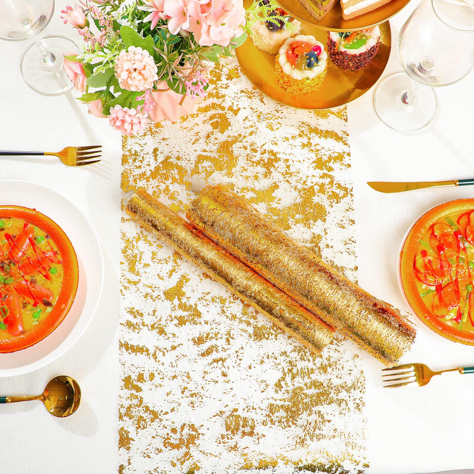 Tatuo gold table runner on dining table adds elegant shimmer.