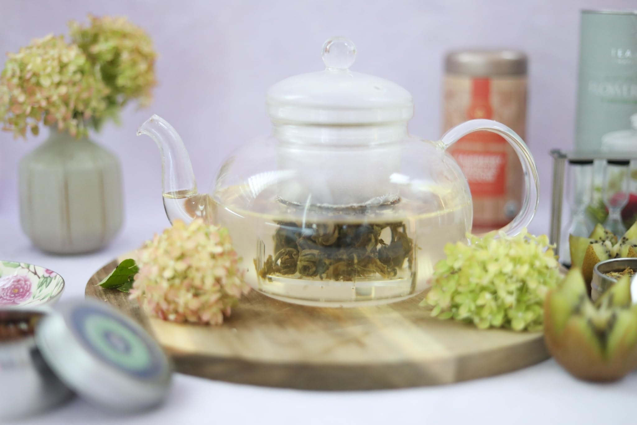 Teabloom four borosilicate glass teacups ready for sharing
