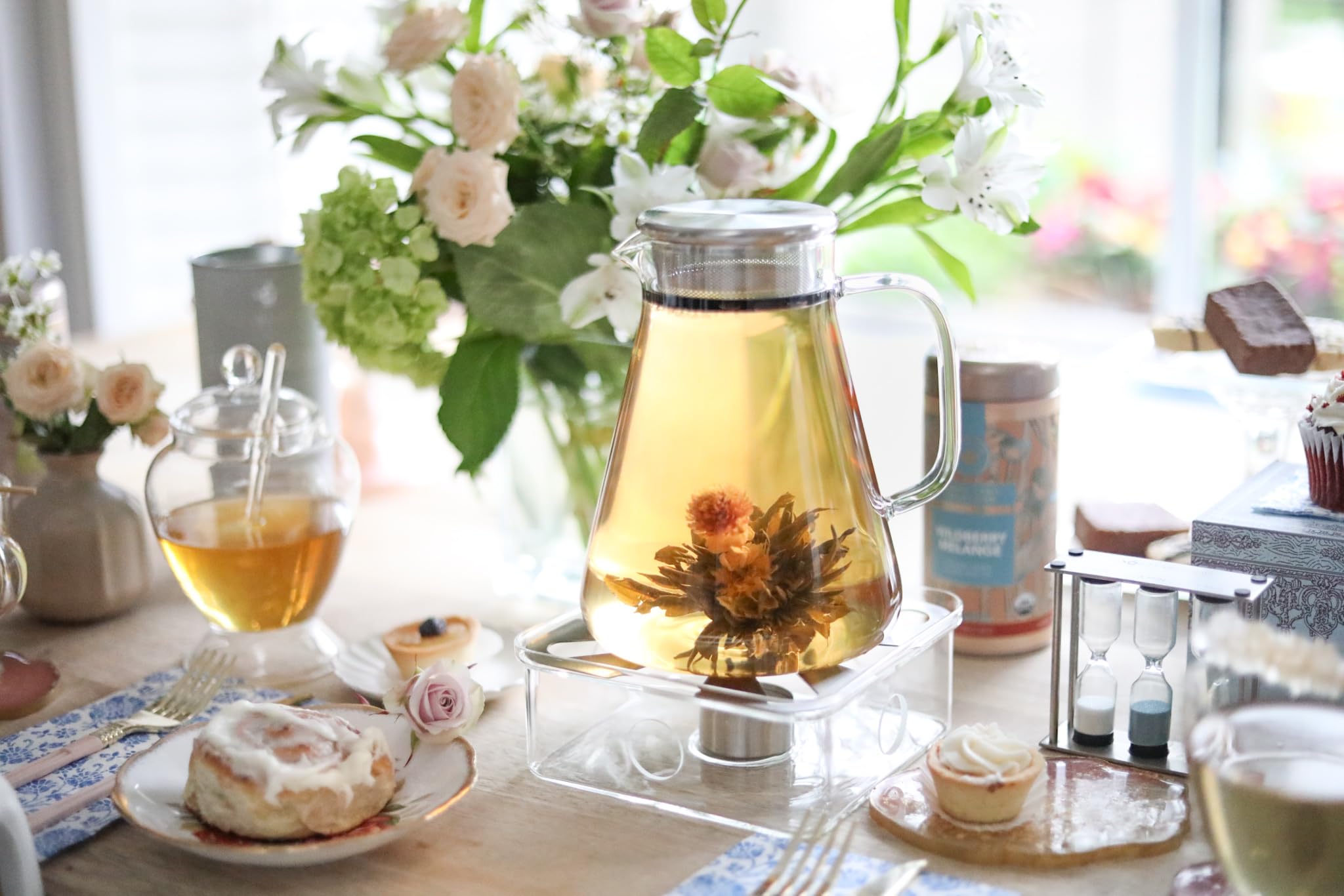 Teabloom One-Touch Tea Maker steeping in a clear glass pot.