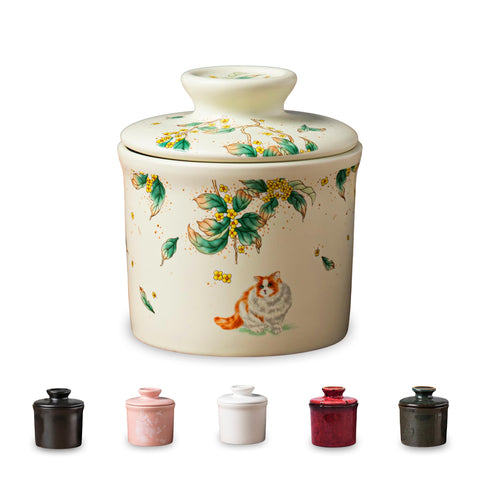 Teapeak porcelain butter keeper crock on counter keeps butter soft and fresh.