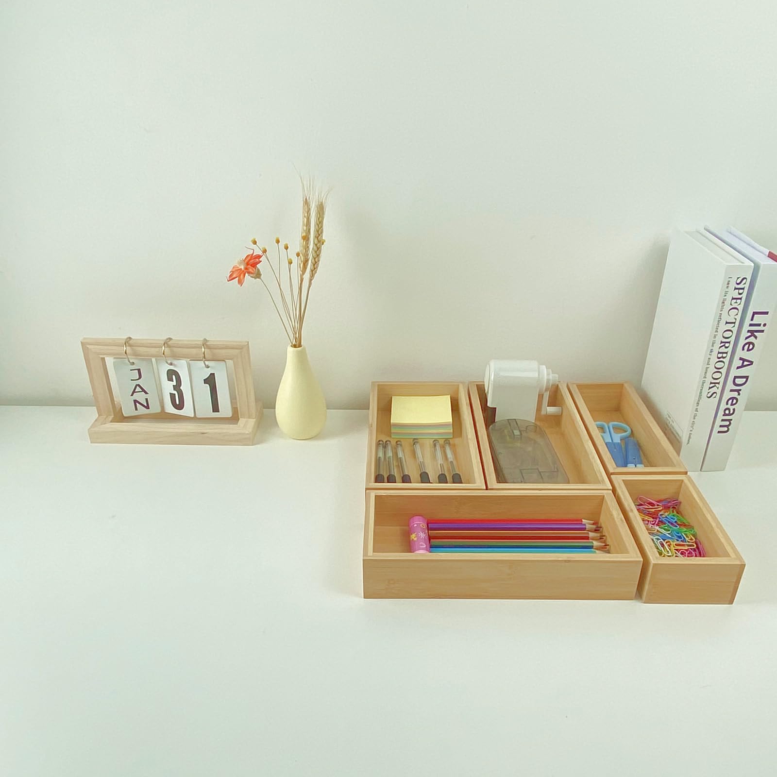 Teicui bamboo kitchen drawer divider keeps utensils organized.