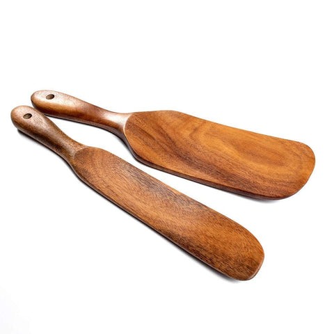 TEZZ Spurtles hung on hooks in a stylish kitchen vignette.