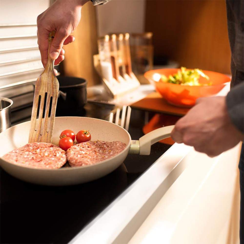 TEZZ Spurtles in use for stirring sauces without scratching pans.