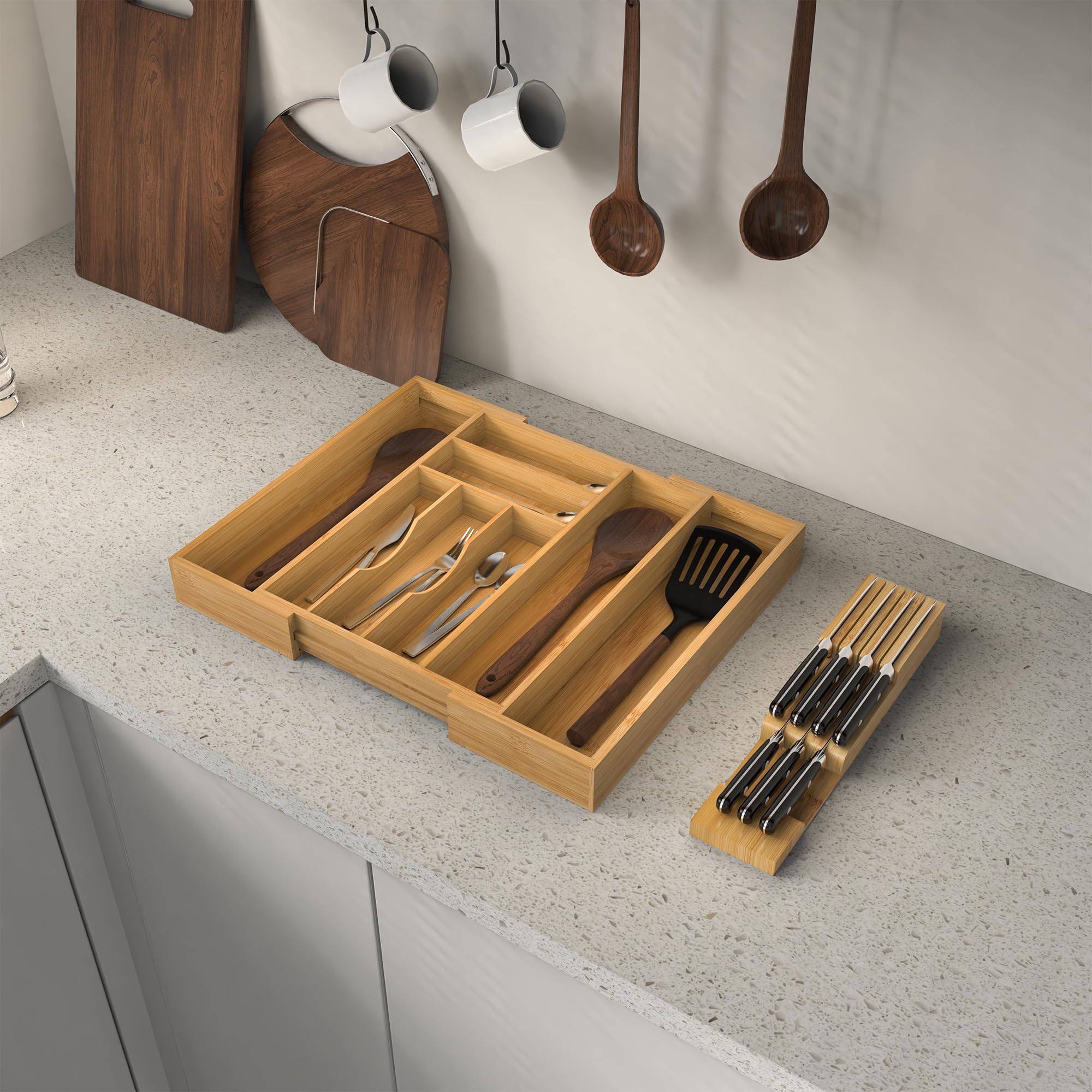 Thalomely Bamboo Drawer Organizer eight compartments separate forks, spoons, and knives.