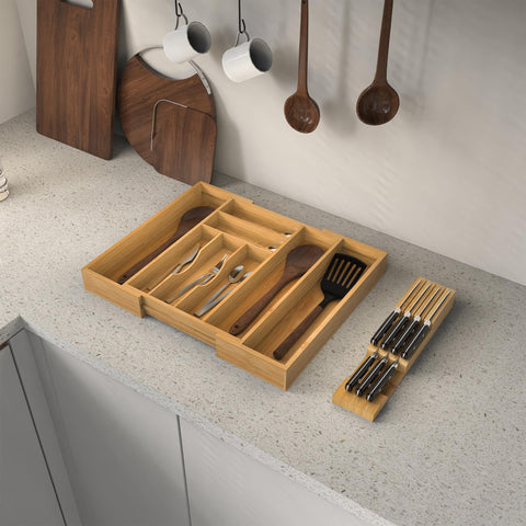Thalomely Bamboo Drawer Organizer eight compartments separate forks, spoons, and knives.