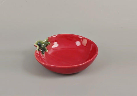 Close-up of The Bridge Collection tomato spoon rest highlighting glossy ceramic finish.