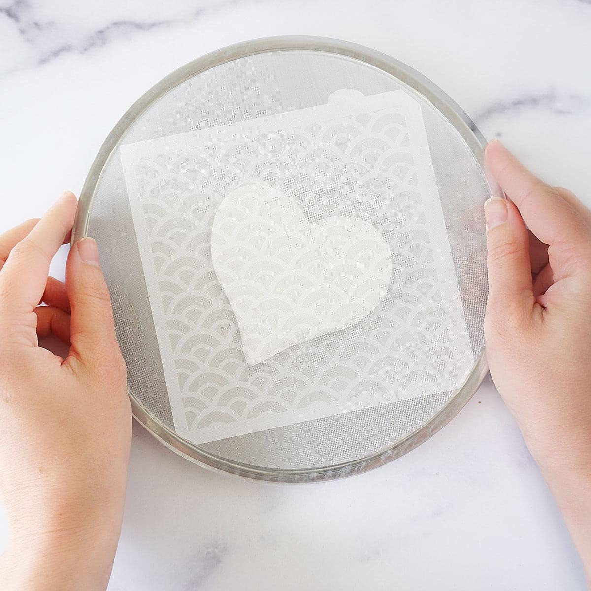 The Cookie Countess Magic Stencil Screen compatible with Stencil Genie expands masking options.