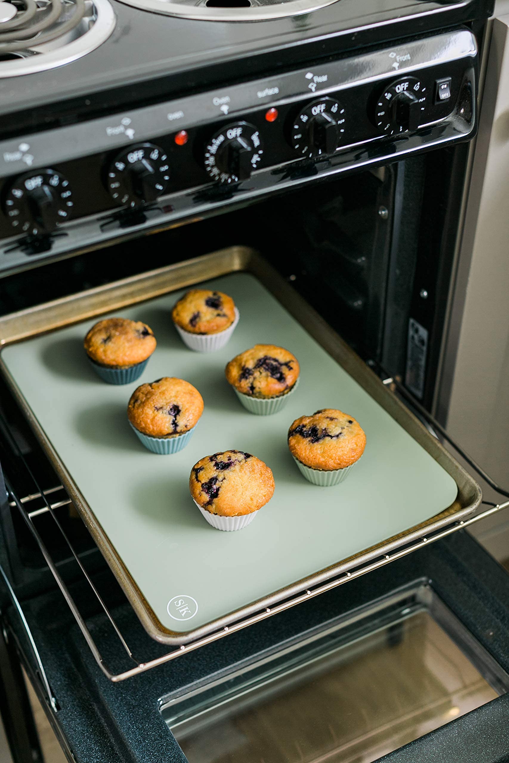 The Silicone Kitchen baking cups navy, in muffin tin, fits standard pans