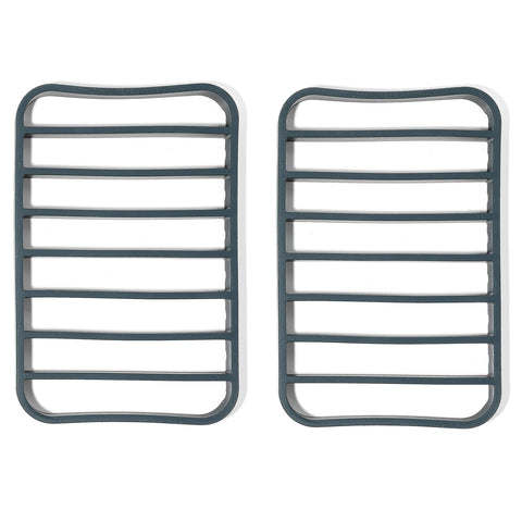 The Silicone Kitchen navy silicone roasting rack on a quarter-sheet elevates food for crisp, even browning.