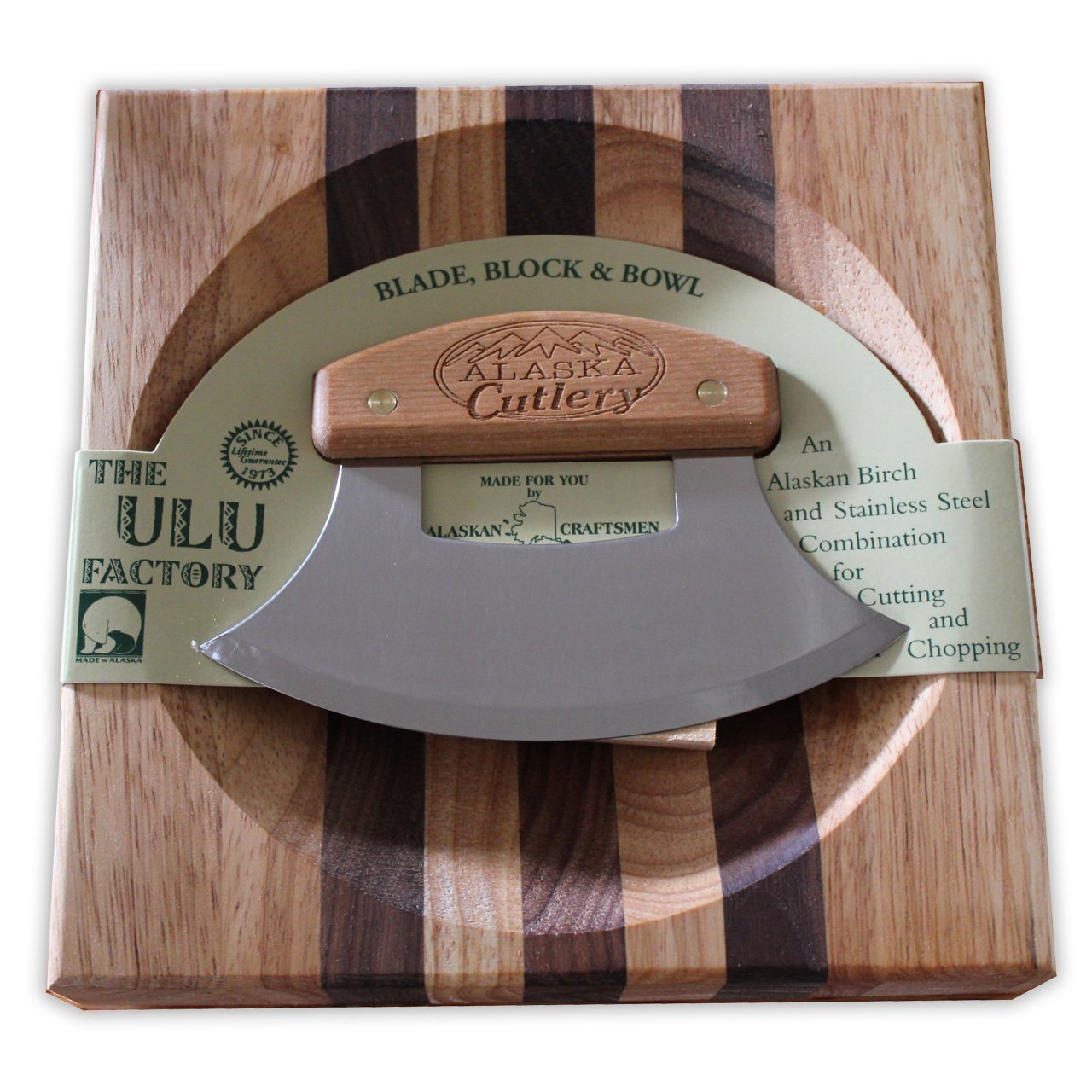 The ULU Factory chopping board mezzaluna beside the bowl speeds prep.