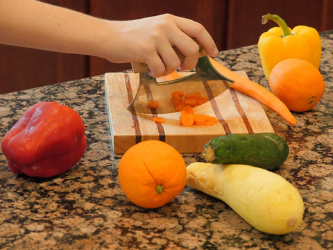 The ULU Factory knife stand keeps the blade safely stored and accessible.