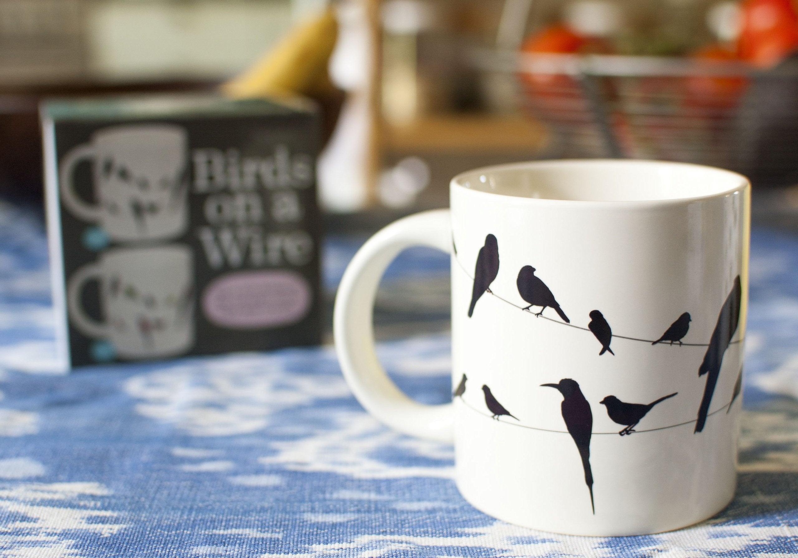 Gift-ready colorful box featuring The Unemployed Philosophers Guild Birds on a Wire mug.