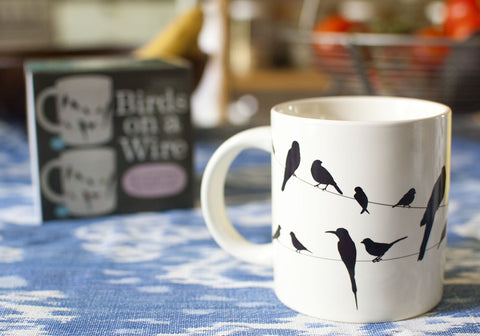 Gift-ready colorful box featuring The Unemployed Philosophers Guild Birds on a Wire mug.