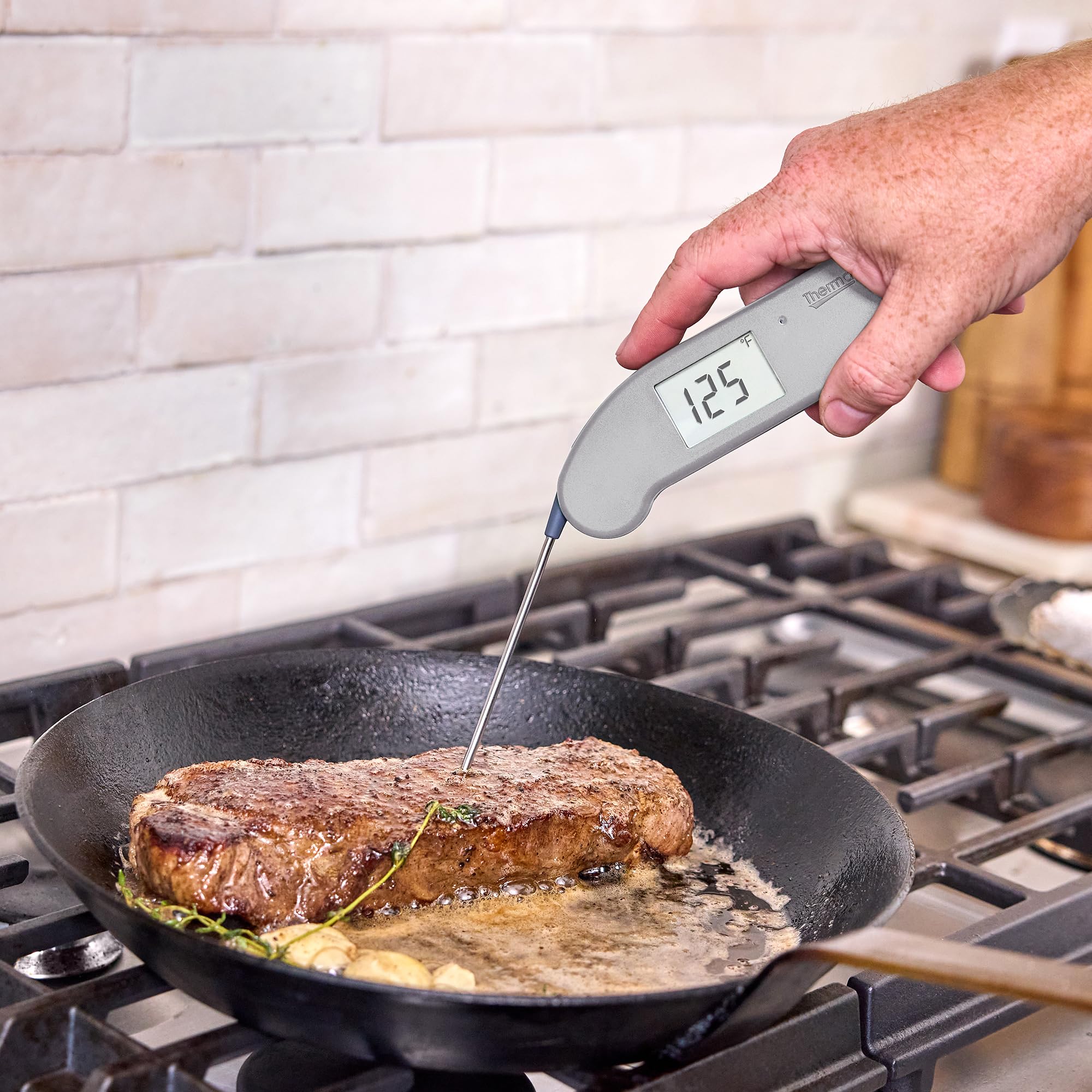 Thermapen ONE with IP67 rating resisting splashes and spills in a busy kitchen.