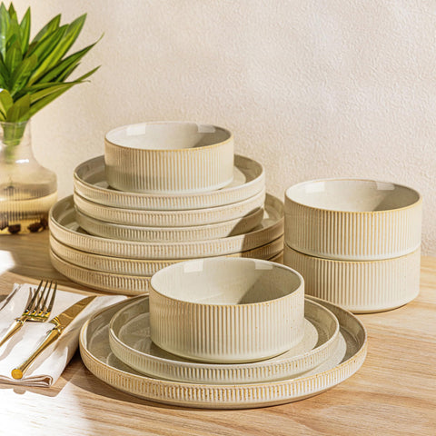 TheTerra ceramic dinner plate in speckled glaze showing a dining setup and subtle color variation