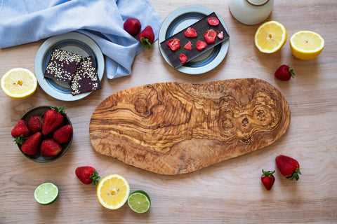 Thirteen Chefs olive wood cutting board cheese service highlights natural color and texture.