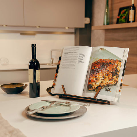 Tilisma walnut cookbook holder keeps recipes steady while cooking.