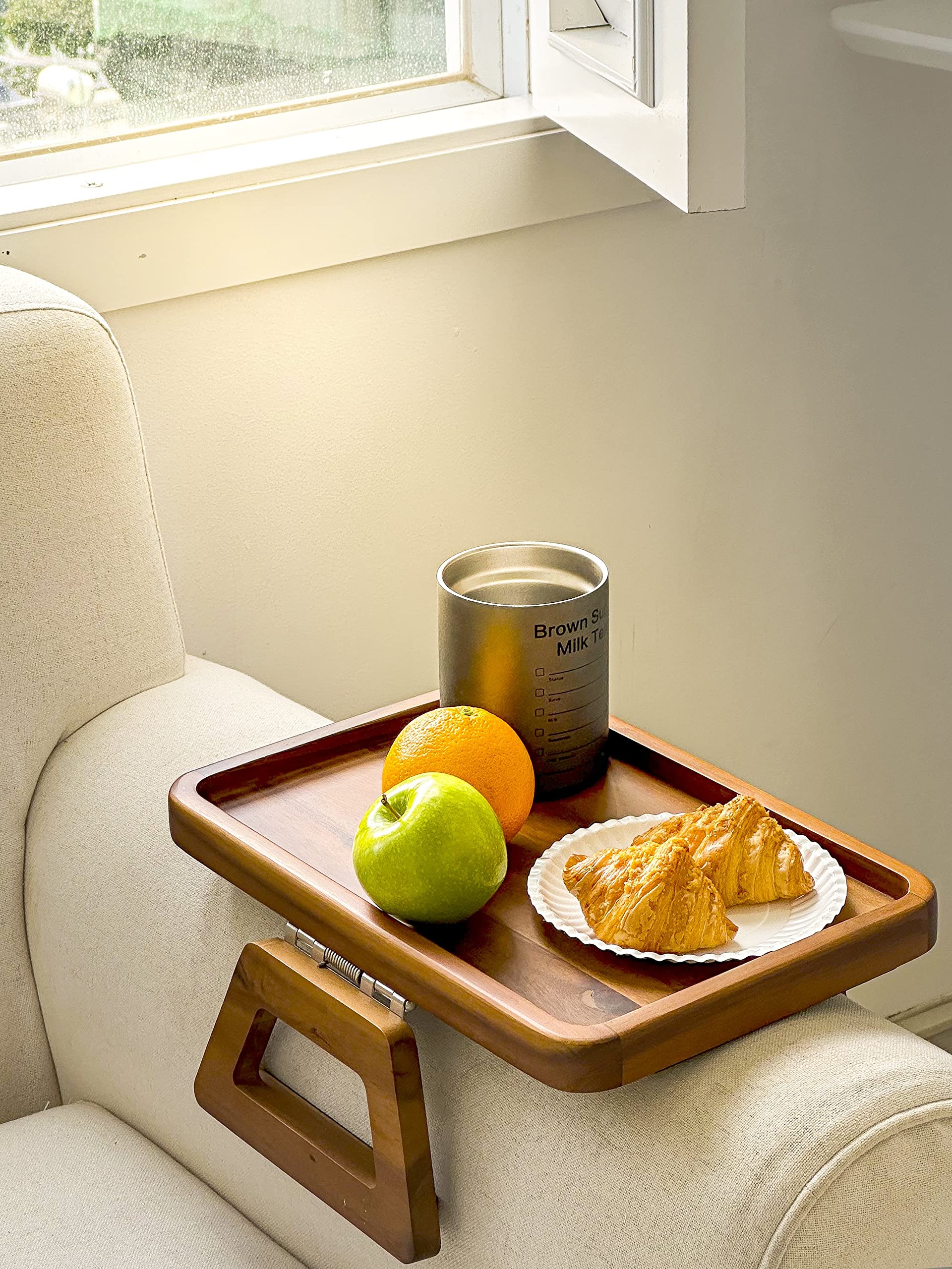 Tinamo acacia arm table with wide-leg support for stability.