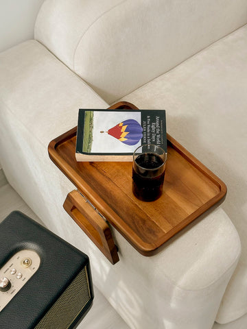 Tinamo acacia compact tray stores discreetly behind sofa.