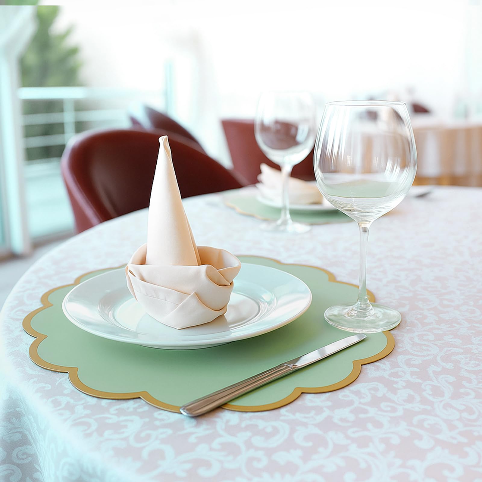 Stacked Tinlade sage green placemats ready for use