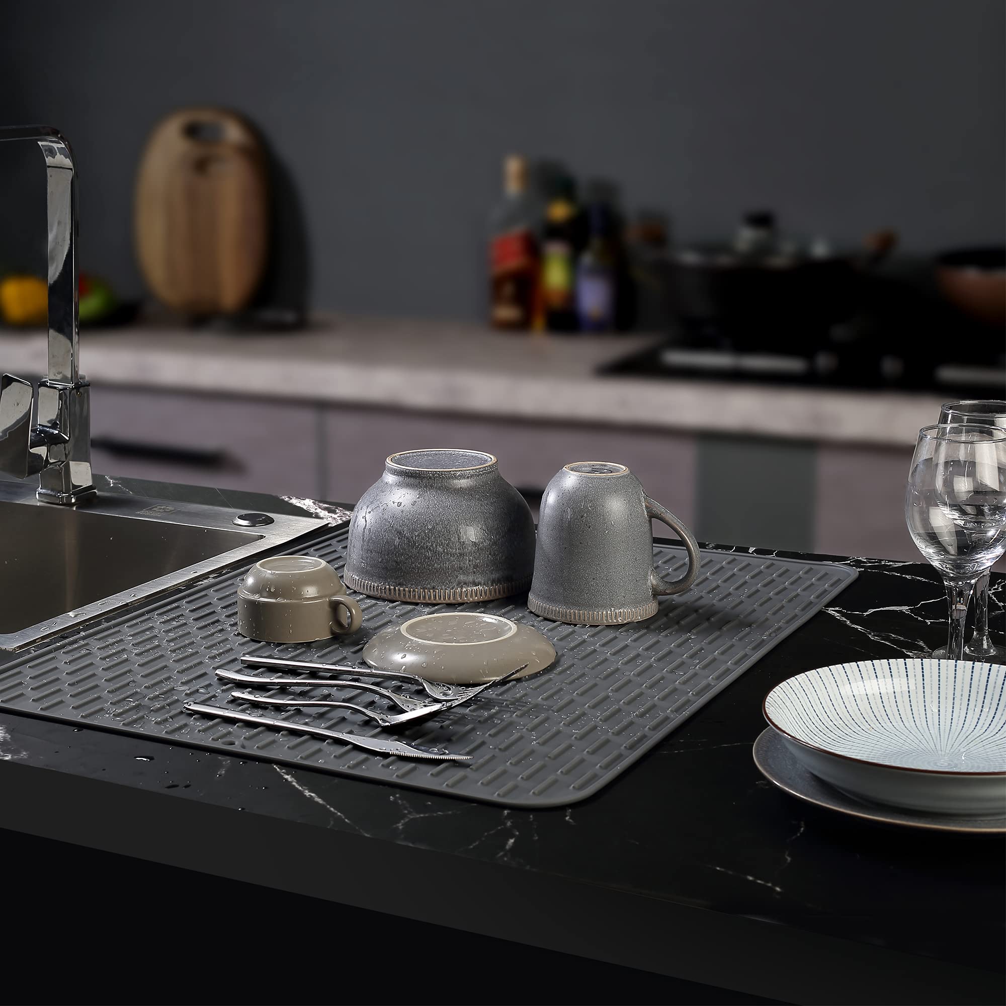 To Encounter extral-large silicone mat on counter keeps surfaces dry and protected.