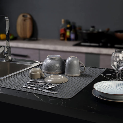 To Encounter extral-large silicone mat on counter keeps surfaces dry and protected.