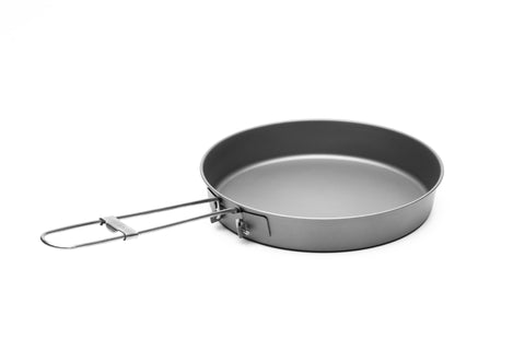 TOAKS Titanium D6.5 165mm frying pan cooking on a camp stove for efficient meals.