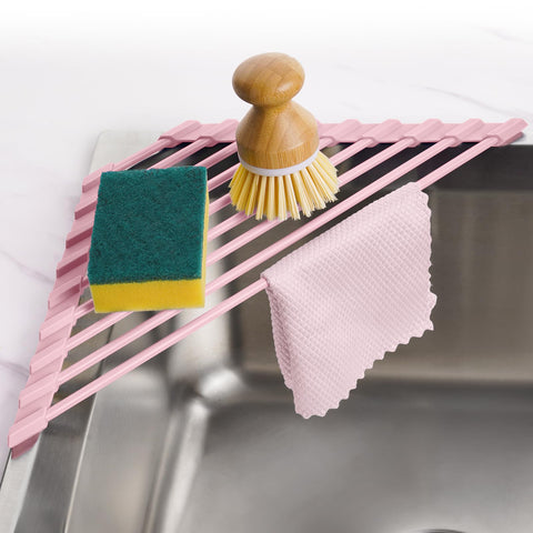 Tomorotec pink triangle dish rack in a corner sink saves counter space while drying dishes.