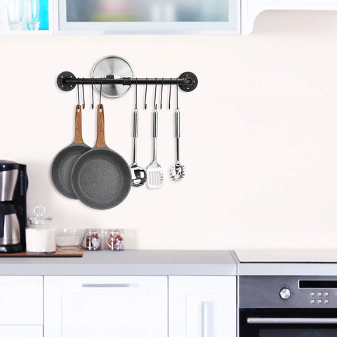 Toplife wall-mounted utensil rail with 10 hooks keeps spatulas and ladles within reach.